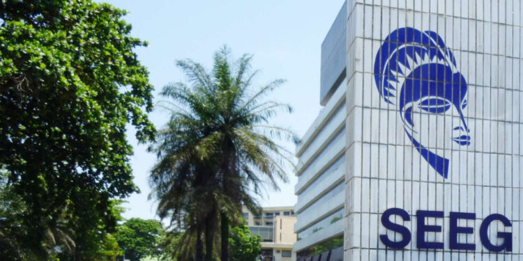 A man walks past the headquarter's of Gabon's energy and water company SEEG (Societe d'energie et d'eau du Gabon) on March 10, 2010 in Libreville. Members of "SOS Consommateurs", a consumer's association have started a hunger strike in protest against SEEG, a subsidary of the French company Veolia. AFP PHOTO / COUMBA SYLLA / AFP PHOTO / COUMBA SYLLA