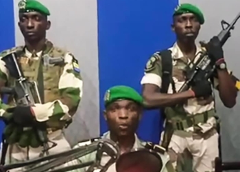 In this video grab made on a video footage obtained on YouTube on January 7, 2019, Gabon soldiers leave a studio of state radio after an address calling on the people to "rise up" and announcing a "national restoration council" would be formed, as an ailing President Ali Bongo is out of the country. - The message was read on state radio by a person who identified himself as the deputy commander of the Republican Guard and head of a group called the Patriotic Youth Movement of the Gabonese Defence and Security Forces. (Photo by - / various sources / AFP) / RESTRICTED TO EDITORIAL USE - MANDATORY CREDIT "AFP PHOTO / YOUTUBE " - NO MARKETING NO ADVERTISING CAMPAIGNS - DISTRIBUTED AS A SERVICE TO CLIENTS